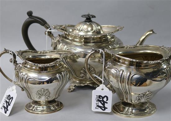 An Edwardian silver three piece tea set by Martin Hall & Co, Sheffield, 1906, gross 44 oz.